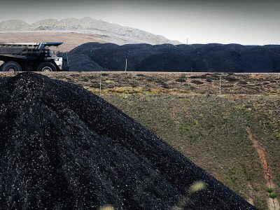 MUSWELLBROOK, AUSTRALIA - FEBRUARY 15:  A coal truck passes a huge pile of coal at BHP Billiton's Mt Arthur coal mine February 15, 2006 in Muswellbrook, Australia. BHP today posted the biggest interim profit in Australian corporate history. The world's biggest mining company announced a half-year after tax profit of $5.9 billion AUD ($4.37 billion USD) a rise of almost 48 per cent from last year.  (Photo by Ian Waldie/Getty Images)